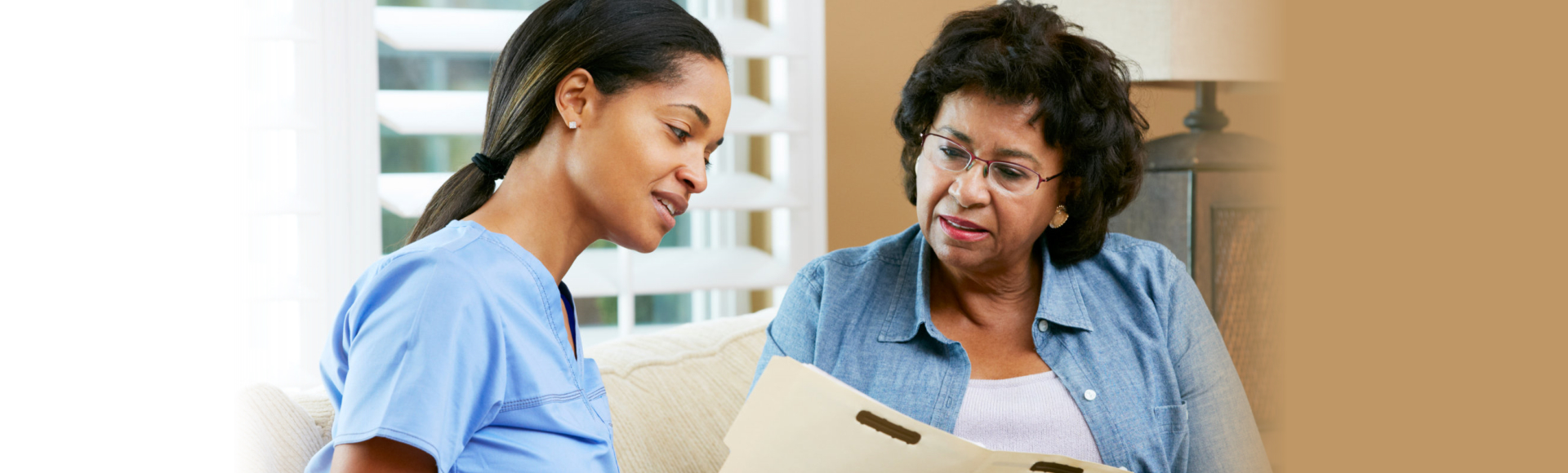 nurse and elderly man smiling